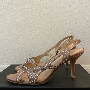 Slip on sparkly rose-colored heels